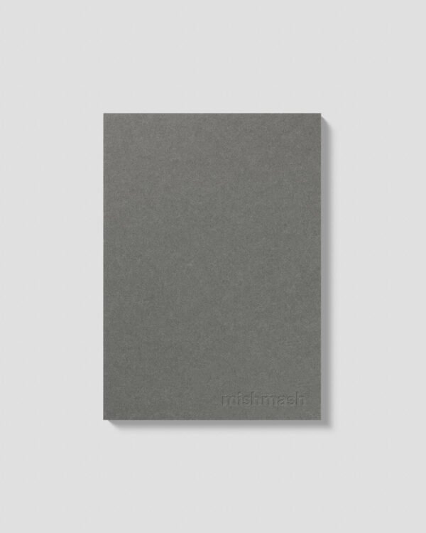 Front view of the Naked A5 notebook by Mishmash in slate grey. The Mishmash logo is embossed on the bottom right.